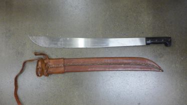 A Legitimo Collins & Co. Vietnam War machete with original leather scabbard, (later added binder)
