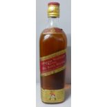 A bottle of Johnnie Walker Red Label Old Scotch Whisky, SB994S16 UCB raised backstamp (in vendor's