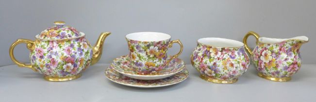 A James Kent chintz teaset for one, a Du Barry pattern chintz teapot, cream jug, sugar bowl, side