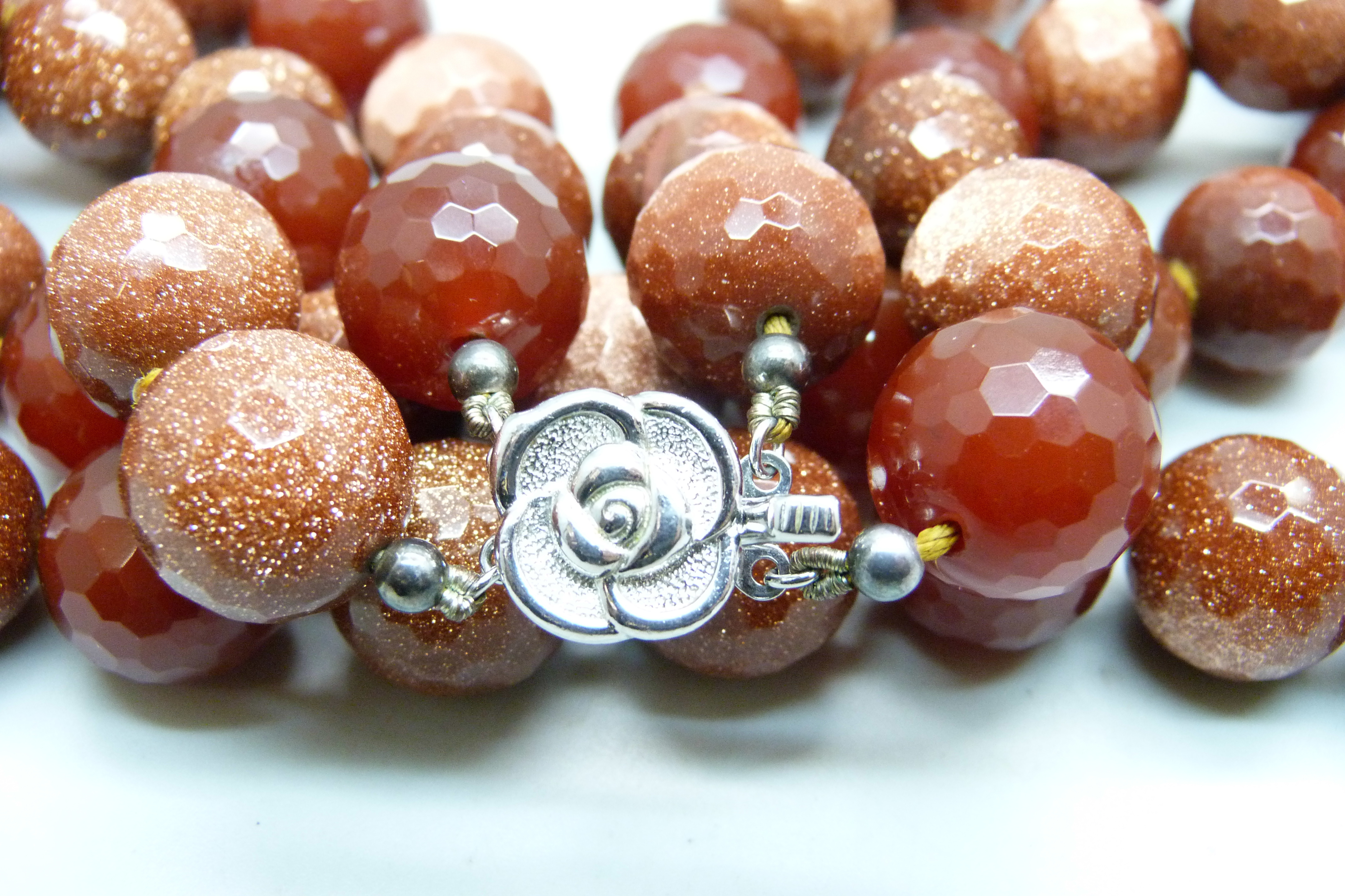 A heavy faceted goldstone and dark red stone bead double string necklace with silver clasp, 278g - Image 3 of 4