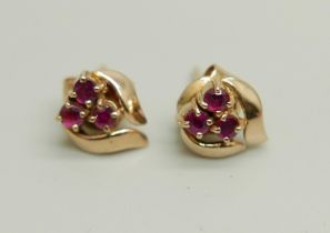 A pair of 14k gold and ruby earrings, 1.5g