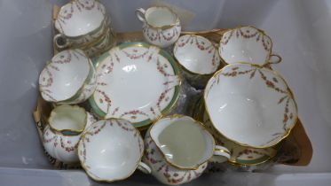 A Crescent England tea set, nine teacups, twelve tea plates, a sugar bowl, two jugs, etc. **PLEASE