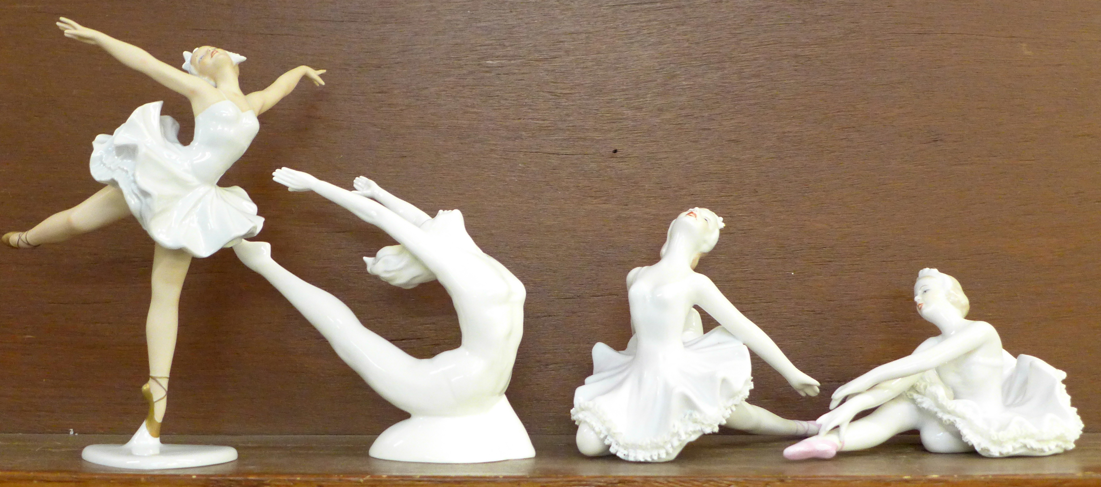 Three Dresden Germany ballerina and a Coalport Sporting Elements Stretching The Limits figurine