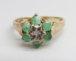 A 9ct gold, diamond and emerald ring, 2.4g, O