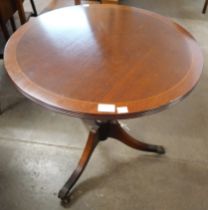 A Regency style inlaid mahogany circular tripod occasional table