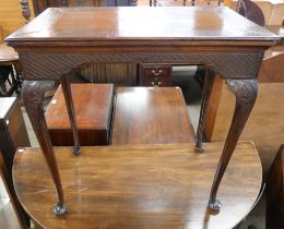 A late Victorian carved walnut side table