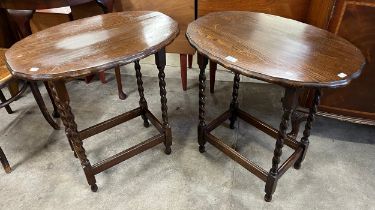A pair of oak barleytwist occasional tables