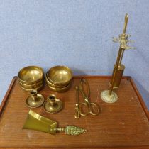 A box of brassware including six heavy bowls and a fire companion