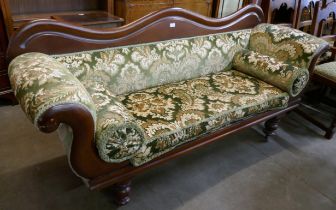 An upholstered chaise longue sofa