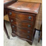 A small George III style mahogany serpentine chest of drawers