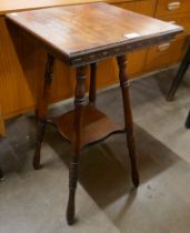 A late Victorian carved oak occasional table