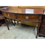 A Regency style mahogany two drawer bow front serving table