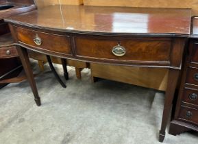 A Regency style mahogany two drawer bow front serving table