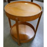 A teak two tier circular cocktail trolley