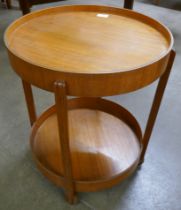A teak two tier circular cocktail trolley