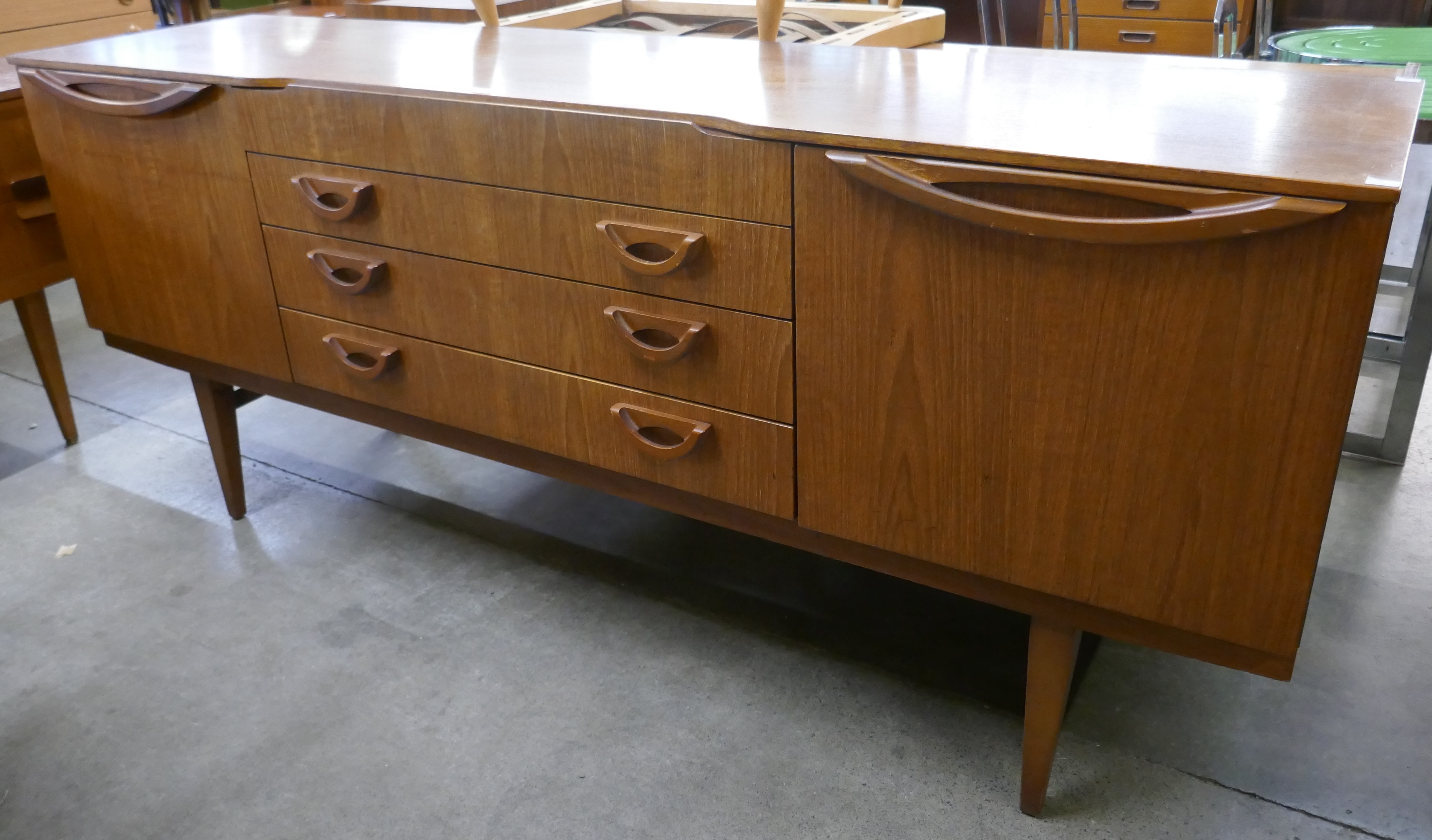 A Beautility teak sideboard