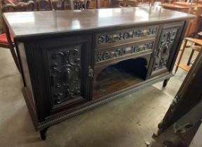 A late Victorian carved walnut sideboard