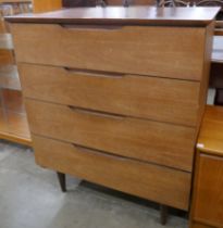 A teak chest of drawers