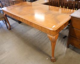 A Queen Anne style walnut dining table