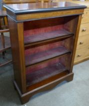 A Victorian inlaid walnut open bookcase