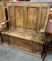 A Victorian style pine settle