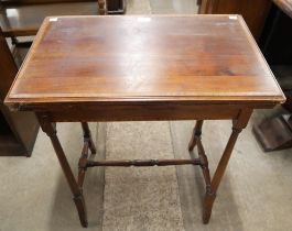 An Edward VII inlaid mahogany fold over card table