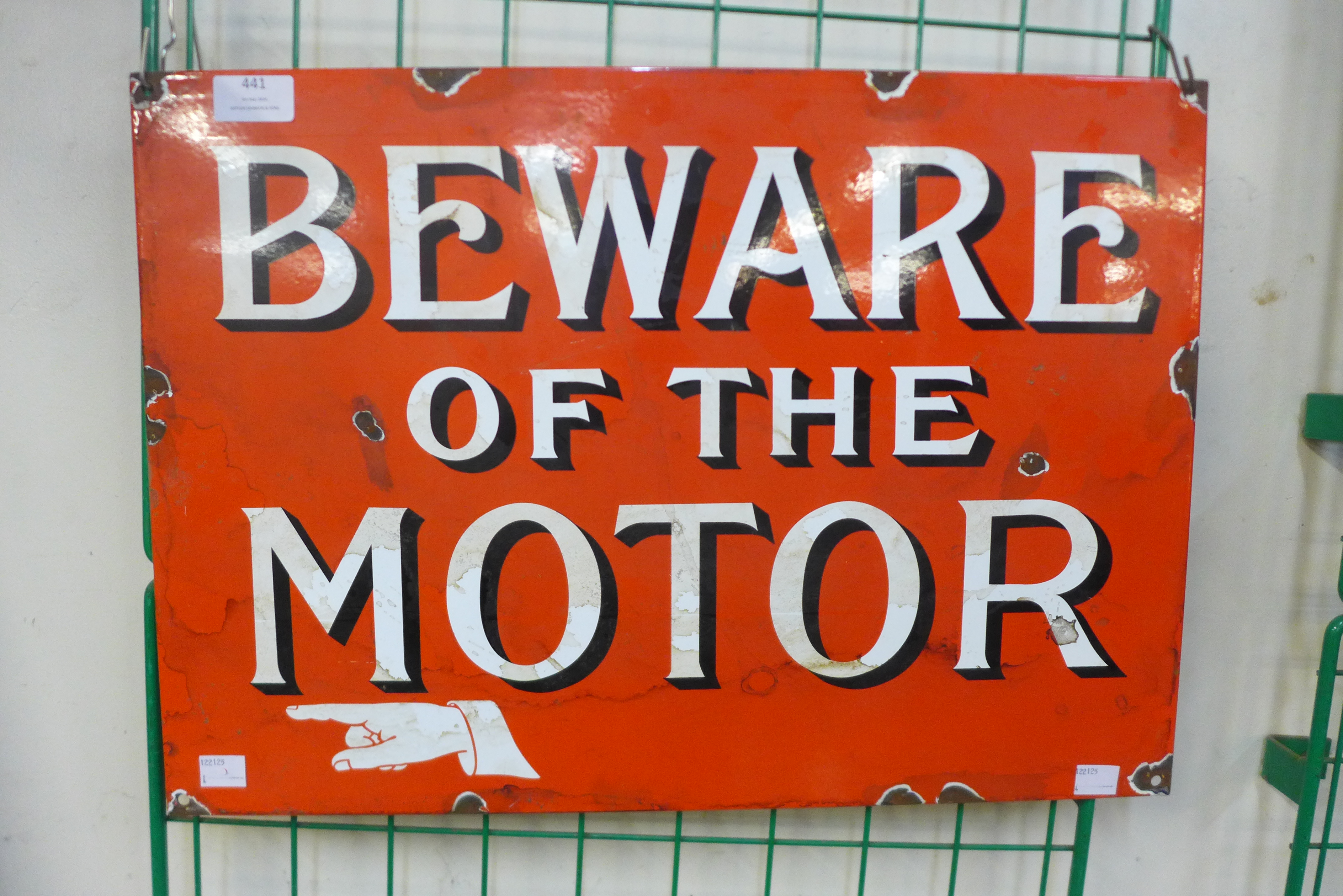 An enamelled Beware of the Motor sign