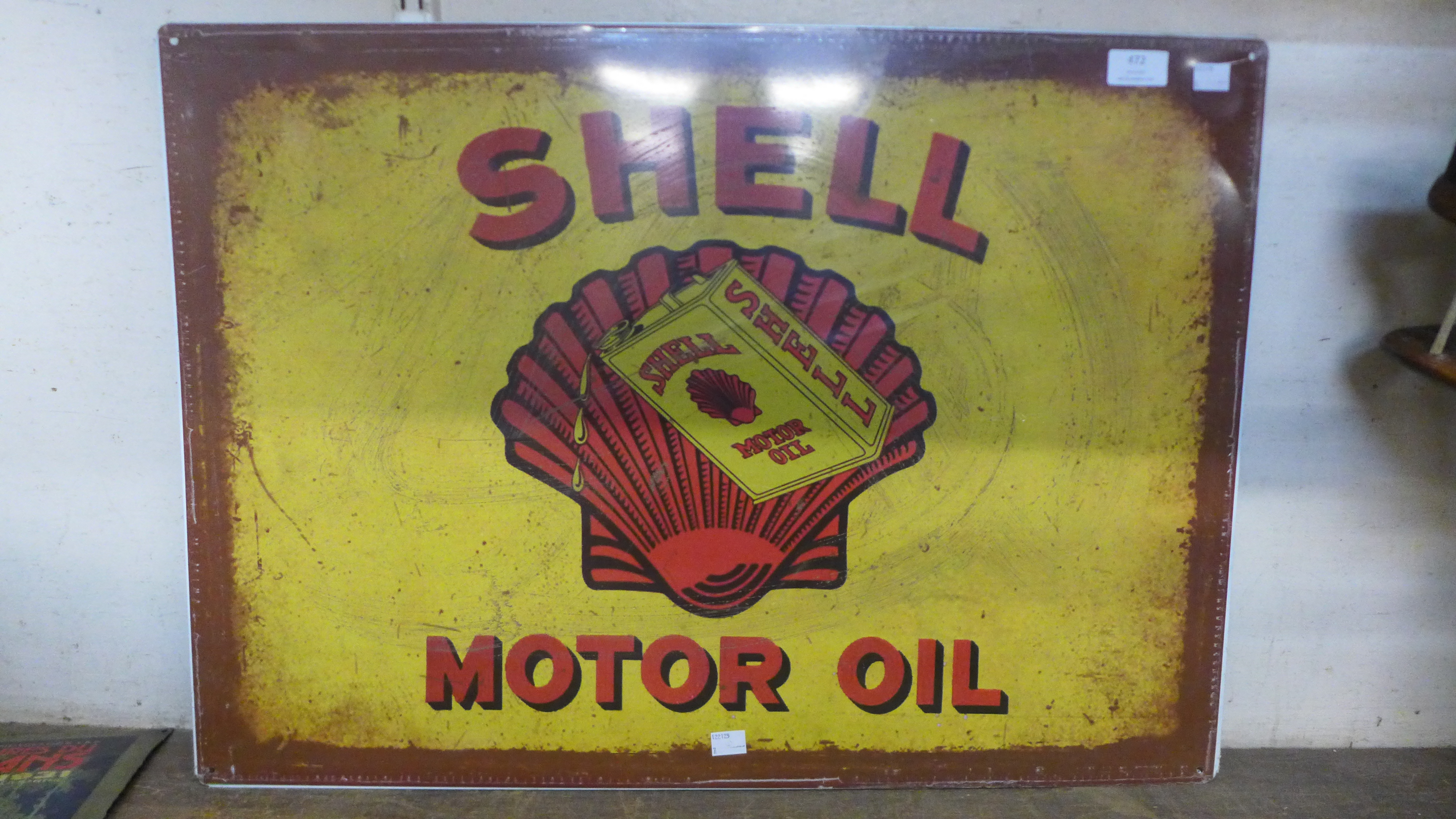 A tin Shell advertising sign