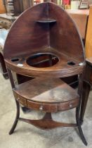 A George III mahogany corner washstand