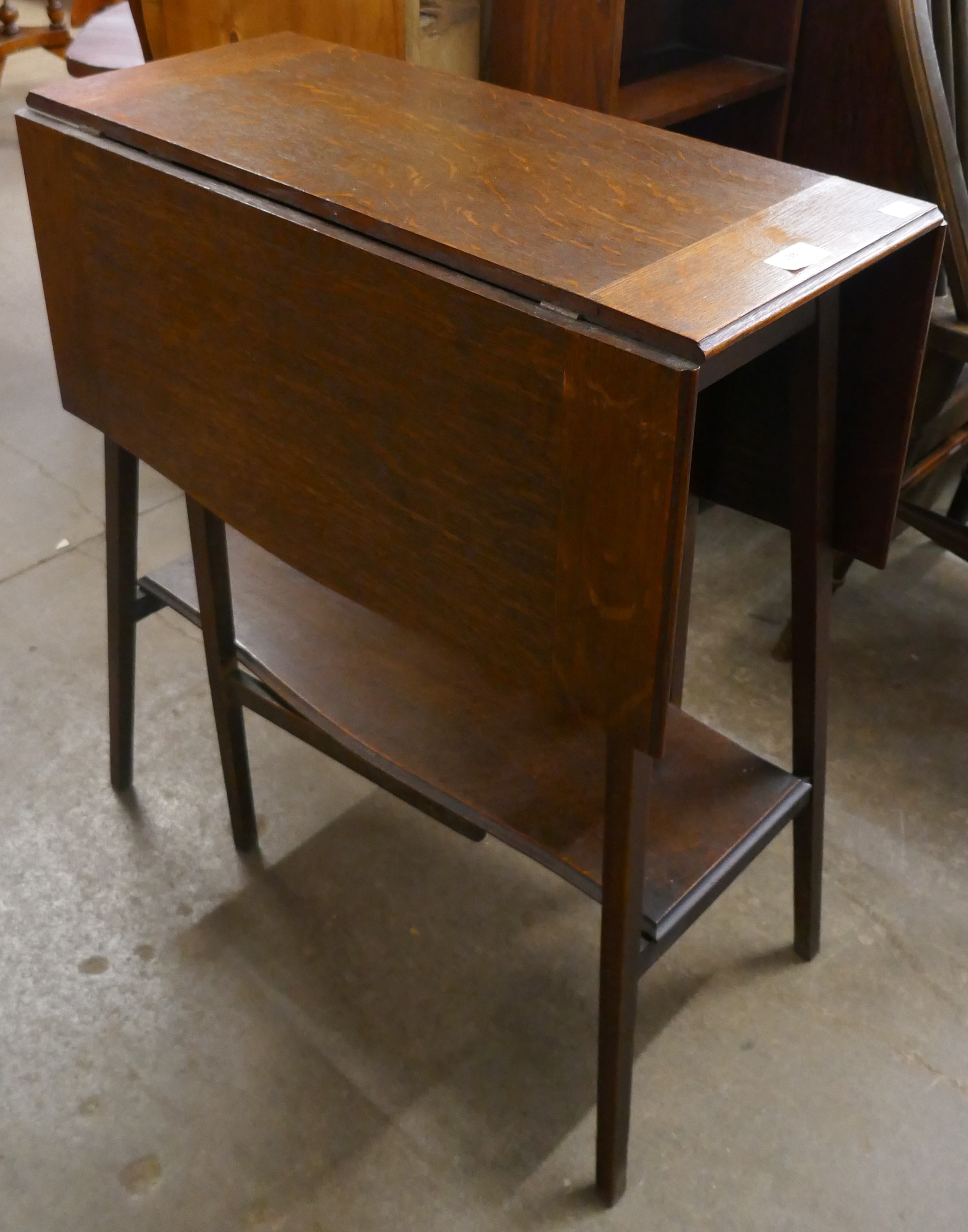 A Liberty's style Arts and Crafts drop-leaf oak table