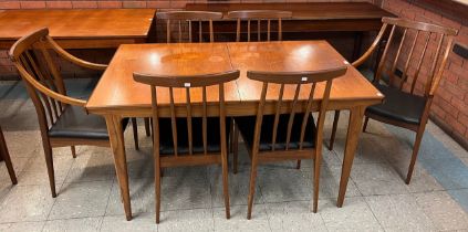 A Younger teak extending dining table and six chairs