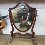 An Edward VII mahogany shield shaped toilet mirror