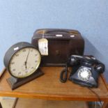 A vintage radio, a mantel clock and a telephone