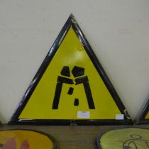 An enamelled metal Falling Rocks warning sign