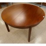 A Danish rosewood circular extending dining table. CITES A10 no. 24GBA10V19RFP