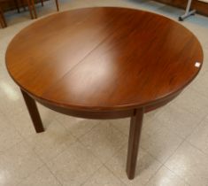 A Danish rosewood circular extending dining table. CITES A10 no. 24GBA10V19RFP