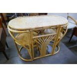 A bamboo and rattan table and two chairs