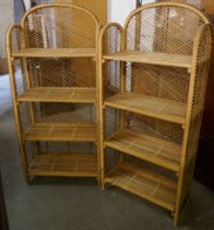 A pair of folding bamboo bookcases