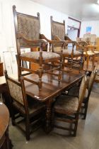 A 17th Century style carved oak refectory table and six chairs