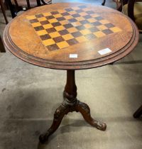 A Victorian inlaid walnut tripod games table