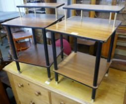 A pair of teak and black leg side tables