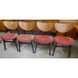 A set of four G-Plan Librenza tola wood and black butterfly-back dining chairs