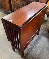 A mahogany drop-leaf table