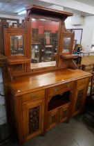 A late Victorian carved walnut mirrorback chiffonier