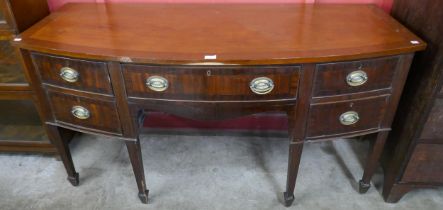 A George III inlaid mahogany bow front sideboard