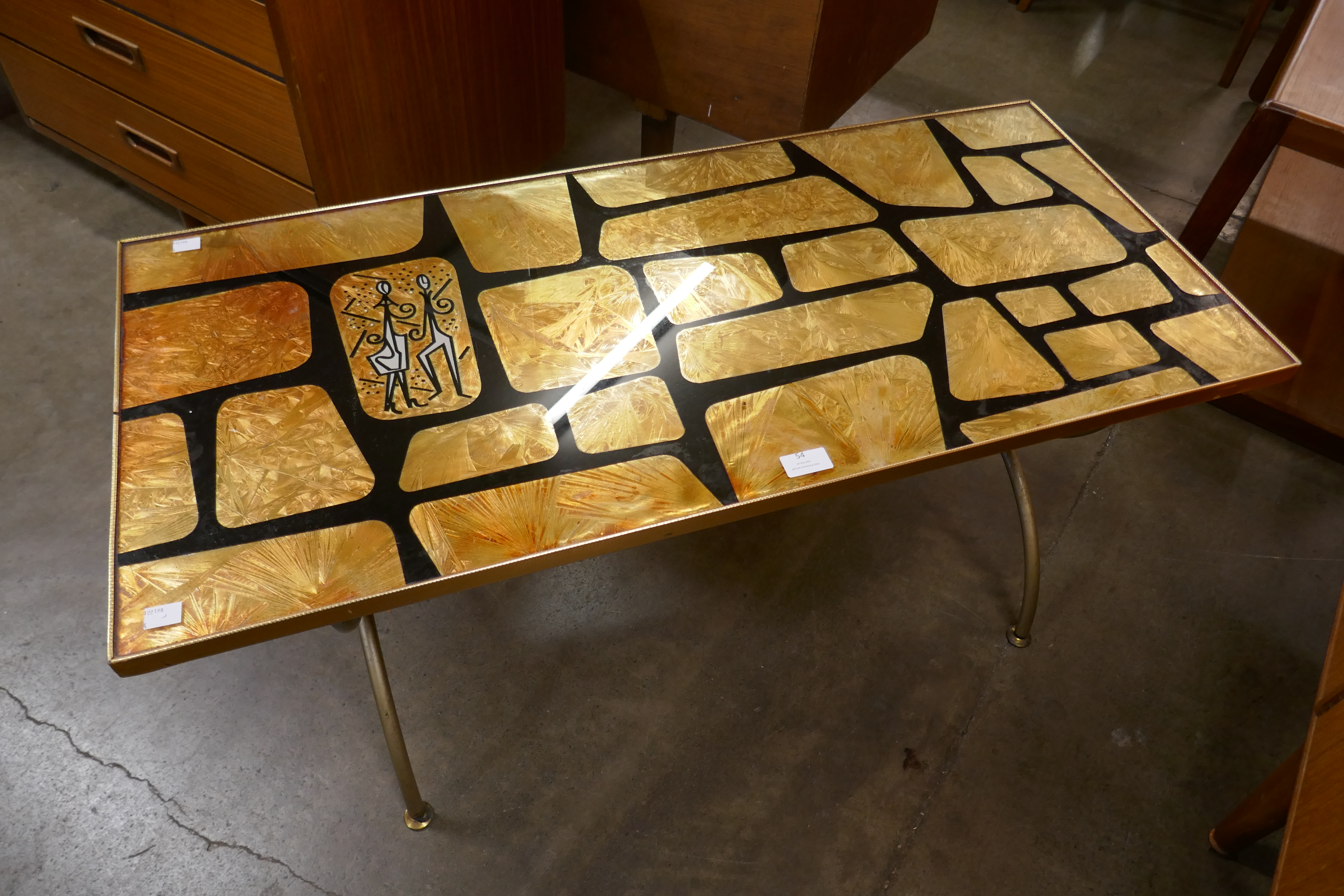 A Denmor of London gold coloured glass and tubular metal coffee table