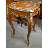 A French Louis XV style walnut and gilt metal mounted single drawer gueridon table