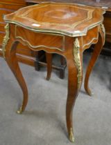 A French Louis XV style walnut and gilt metal mounted single drawer gueridon table