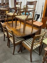 A Regency style mahogany pedestal dining table and six chairs
