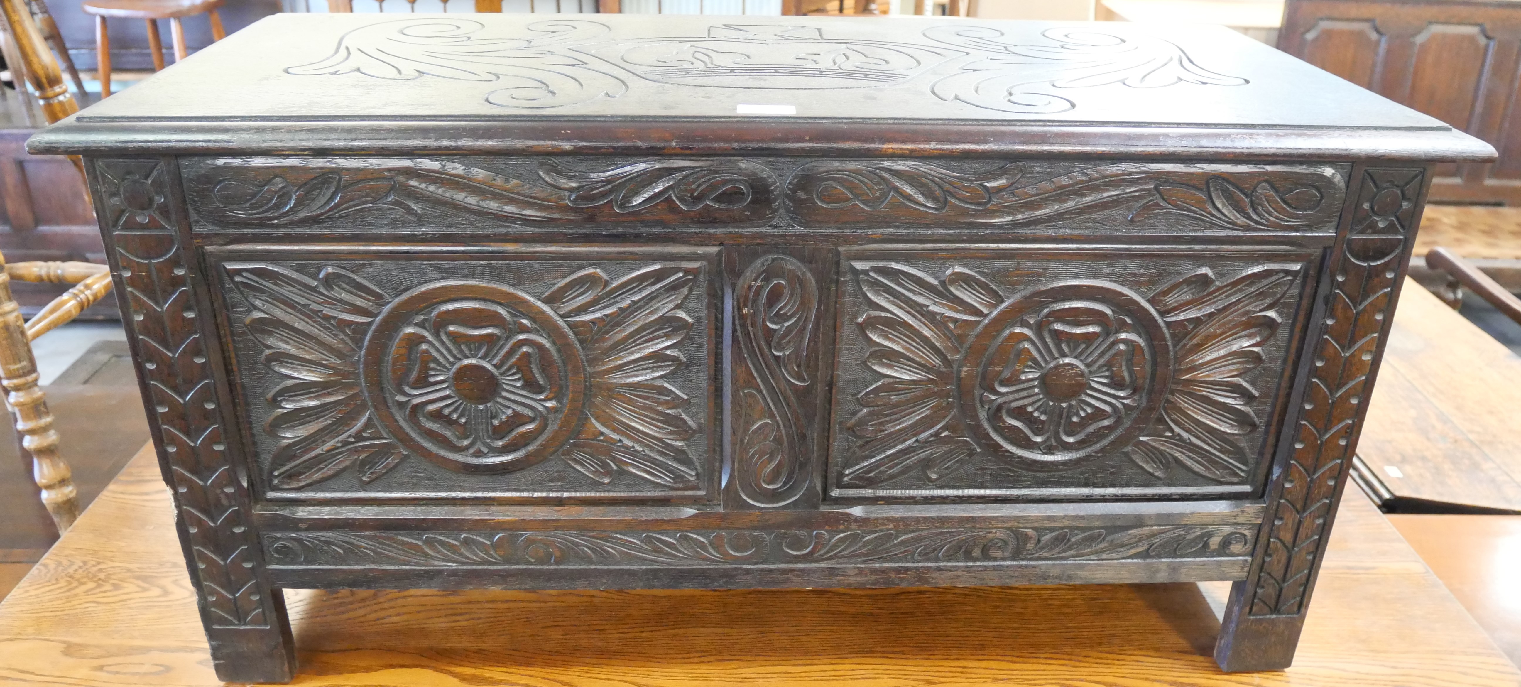 A 17th Century style carved oak blanket box